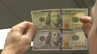 WEB EXTRA Comparing a fake and real 100 bill [upl. by Irodim986]