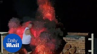 Terrifying moment man is engulfed in flames as he adds fuel to BBQ  Daily Mail [upl. by Gipson]