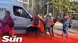 Protesters block fire engine and ambulance before van driver nudges them [upl. by Sakram]