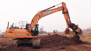 Case CX250C With An Engcon Tiltrotator Spreading Topsoil [upl. by Enoval]