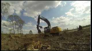 Deere 270D Excavator Clearing Land [upl. by Thgiwed]