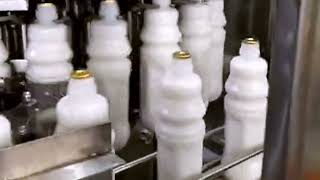 Milk bottles filling aluminum foll foil sealing machine 4 in one equipment [upl. by Leiva]