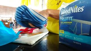 Placing a disposable absorbent insert intro a GoodNites TRUFIT Real Underwear LXL for boys [upl. by Bilak]