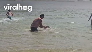 BareHanded Man Dives To Catch Fish  ViralHog [upl. by Fidelia]