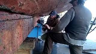 Commodores Boats caulking garboard seam with hawsing iron and beetle [upl. by Eislehc198]