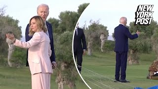 Biden appears to wander off at G7 summit before being pulled back by Italian PM [upl. by Mountford]