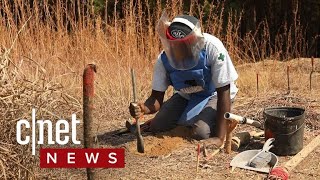 Solving Angolas land mine crisis CNET News [upl. by Anirehtac]