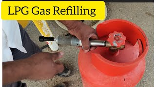 Very easy way to refills ⛽cocking gas  How to refill a cocking gas cylinder in a Moto gas station [upl. by Calandria977]