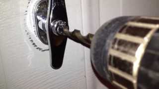 How to drill out a garage door handle lock [upl. by Enirehs]