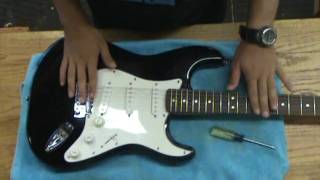 Adjusting a guitar tremolo system [upl. by Labanna]