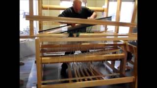 Using the reed to spread warp threads for loom weaving [upl. by Lichtenfeld]