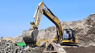 Caterpillar excavator works loading sand into a dump truck  4k [upl. by Kurtzig]