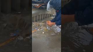 Clean up trash clogged culvert drain under raindrops shorts cleaning satisfying plastic [upl. by Aeneas]