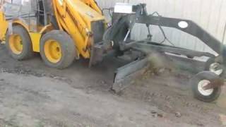 JCB 1CX and grader attachment landscaping a yard [upl. by Heydon]