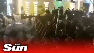 Angry Foxconn workers fight security personnel in China over working conditions [upl. by Ymorej]