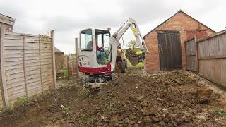 Digging out a rear garden and loading dumpers with a mini digger excavator Takeuchi TB216 Thwaites [upl. by Aral]