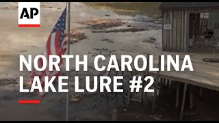 A mass of debris covers North Carolinas Lake Lure days after Hurricane Helene [upl. by Lorn]