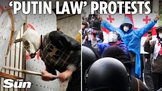 Protesters and cops clash in Georgia after nations parliament passes hated proRussian law [upl. by Ecnirp]