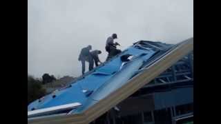 Installing roofing foil as sarking on a metal framed roof [upl. by Ambrosane]