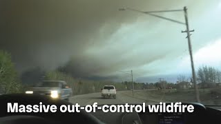 Massive outofcontrol wildfire in northern Manitoba forces evacuations [upl. by Attoynek]