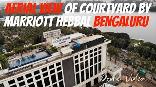 AERIAL VIEW OF COURTYARD BY MARRIOTT HEBBAL BENGALURU  Drone Video of North Bangalore [upl. by Aonian]