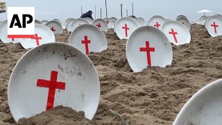 Empty plates on Copacabana beach in Rio highlight plight of worlds hungry [upl. by Aldous604]