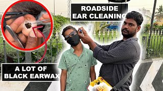 Ear Cleaning a Kid On The Indian Roadside Big pieces of black earwax asmr ear cleaning Vijayawada [upl. by Ignatz77]