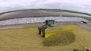 John Deere 9560R with Degelman 7900 Dozer Blades Piling Corn Silage [upl. by Analiese]