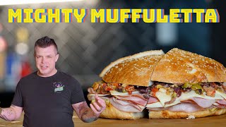 How to Make the Perfect Muffuletta  Mighty Muffuletta Sandwich  New Orleans Recipes [upl. by Icak420]