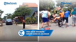 Viral Pria Naik Xpander Hitam Sebar Uang di Jalanan Jombang [upl. by Eikcor]