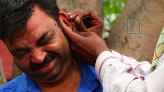 Ear Waxing  Traditional ear cleaner in India [upl. by Eveline]