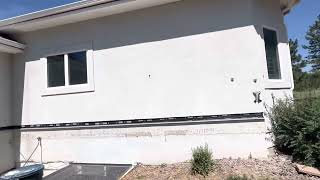 Cut stucco wall to create water table for cultured stone installation below stucco [upl. by Brodsky967]