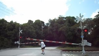 Railroad Crossing Gate Malfunctions Hits Man On The Head [upl. by Jedlicka]