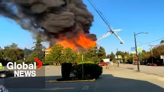 Massive fire in Vancouver brings down crane destroys home [upl. by Jelks]