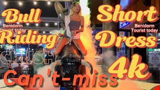 Girl 🧒 Bull 🐂 riding in short dress  Mechanical bull 🐂 riding Benidorm bull  Bull riding [upl. by Joris984]