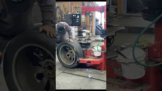 “The process of replacing a tire at a garage in the United States” [upl. by Gereld]