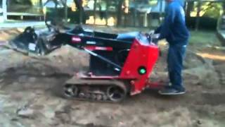 Toro Dingo TX 525  grading with spilt bucket [upl. by Lynn]