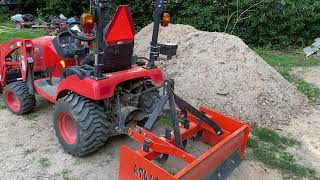 Kioti CS2520 subcompact tractor with Box Blade and SL2420 Loader [upl. by Ynaoj956]