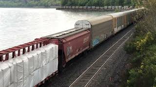 BNSF drag freight meets a commuter train at Carkeek Park near Seattle on April 28 2002 [upl. by Avram]