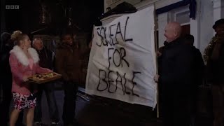 Eastenders Phil holds up a sign for Ian during him singing for the carols saying squeal for Beale [upl. by Aerdno465]