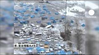 Horror quake hits Japan as tsunami smashes city [upl. by Llerdnad]