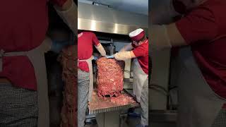 Chef preparing kebab and grill shawarma meat at a street food market [upl. by Elden]