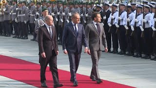 Scholz Macron and Tusk in Berlin for Ukraine talks  AFP [upl. by Azer]