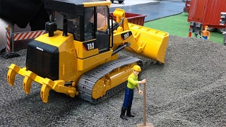 BRUDER TRUCKS CAT 973D Track Loader with PLAYMOBIL 👮BRUDER Caterpillar LOADERS Construction [upl. by Anawahs]