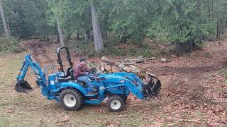 moving logs with a subcompact tractor and grapple TimeLapseLS xj2025h and Land Pride 54 grapple [upl. by Gurolinick]