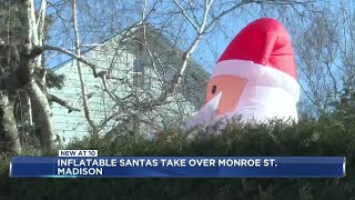 Inflatable Santas take over Monroe Street [upl. by Iaka757]